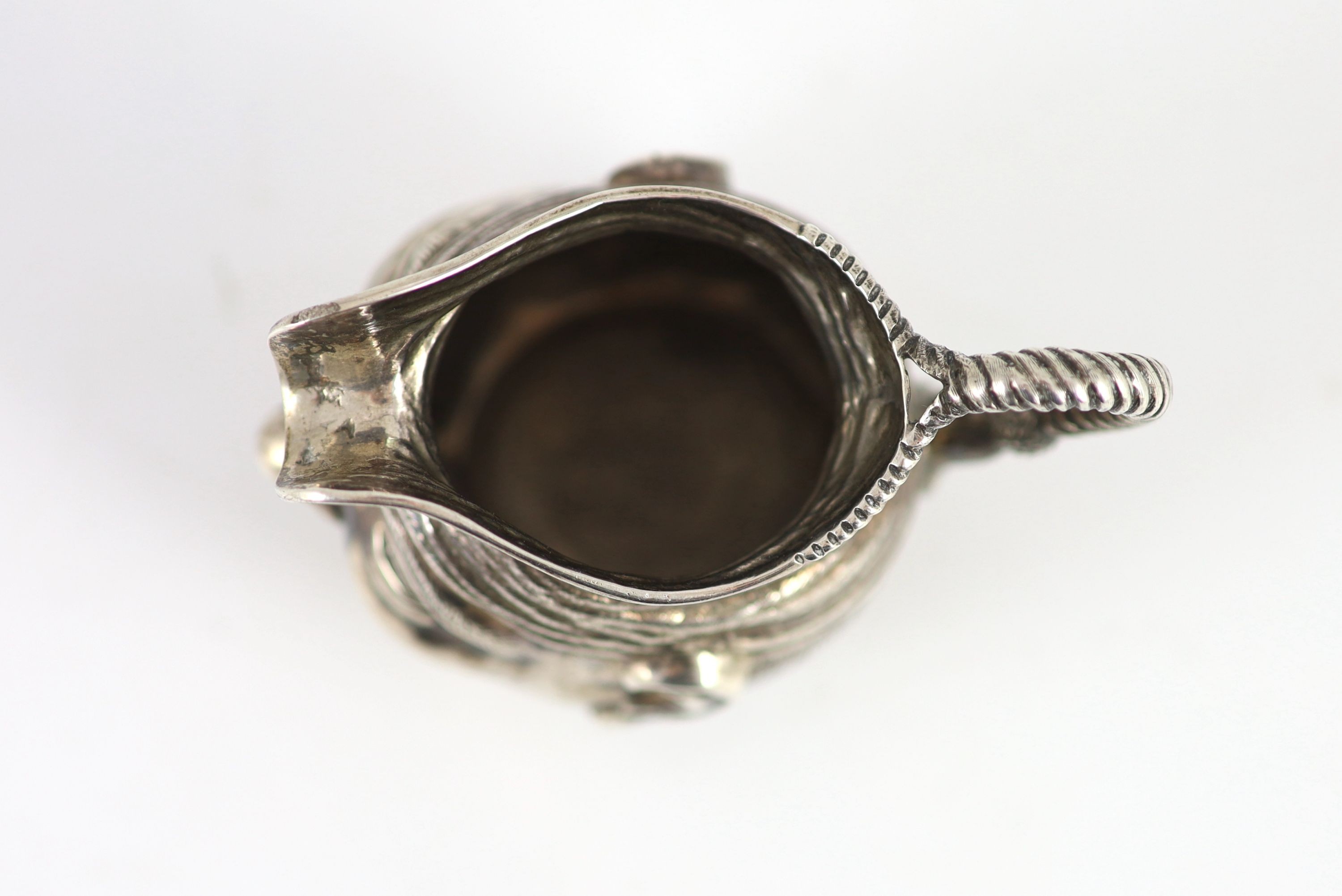 An Edwardian novelty silver cream jug, modelled as a gentleman's head with turban?, Williams, Birmingham, Ltd